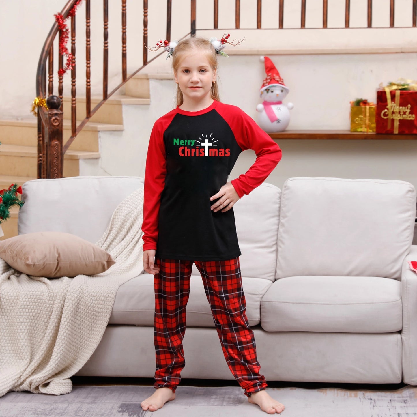 Kids’ matching Christmas pyjamas in red festive pattern