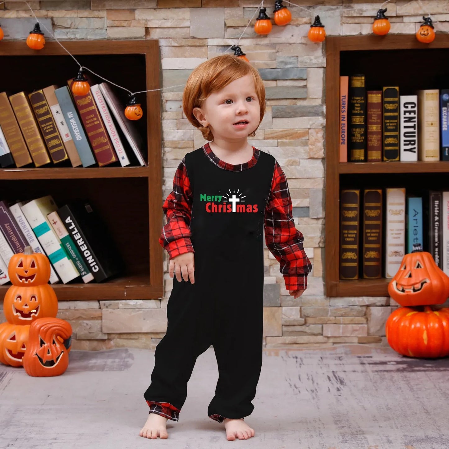 Toddler wearing matching family Christmas pyjamas